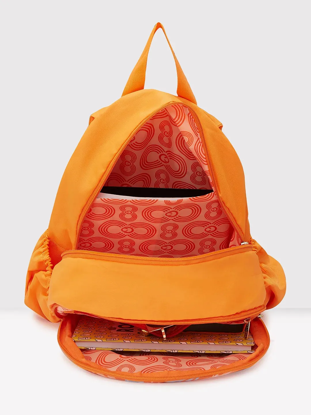 Caprese Xenia Medium Orange Printed Backpack