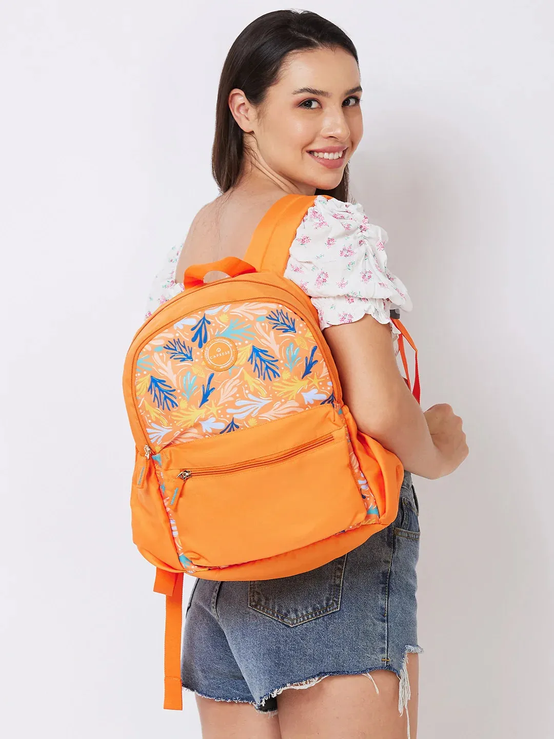 Caprese Xenia Medium Orange Printed Backpack