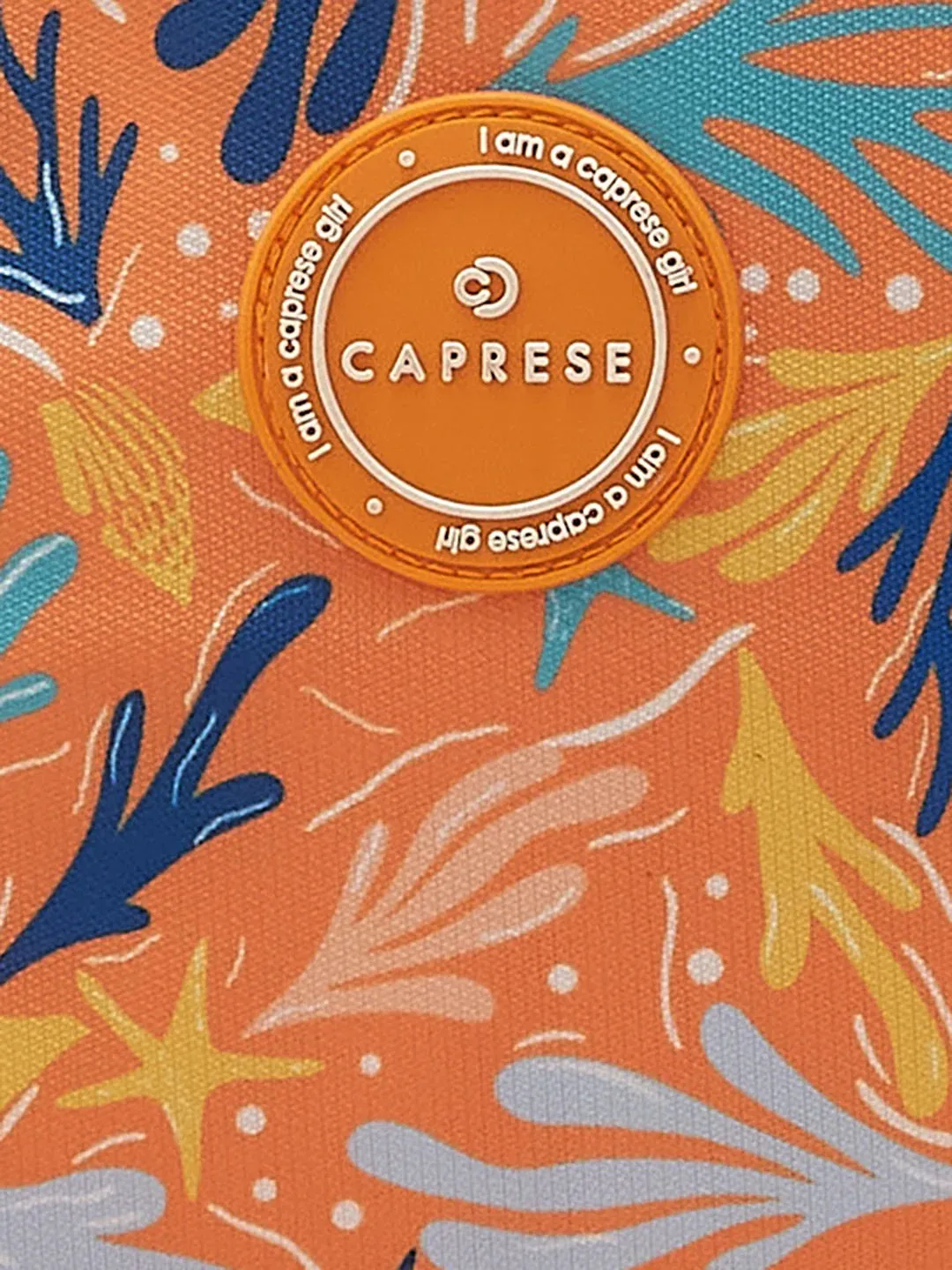 Caprese Xenia Medium Orange Printed Backpack