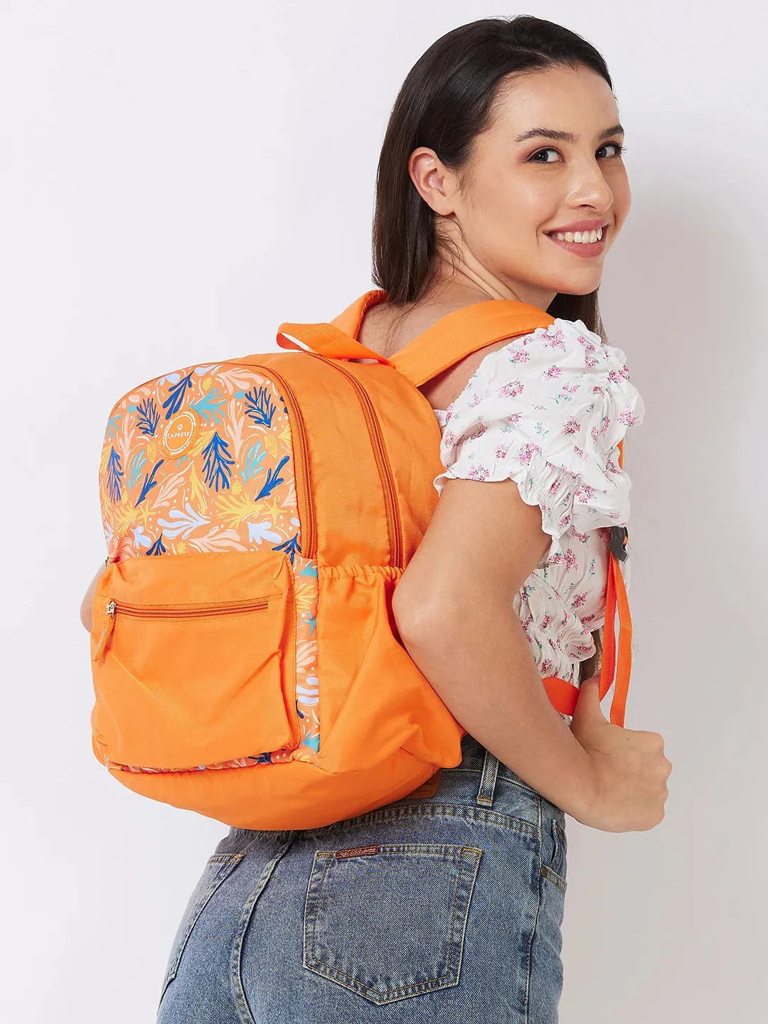 Caprese Xenia Medium Orange Printed Backpack