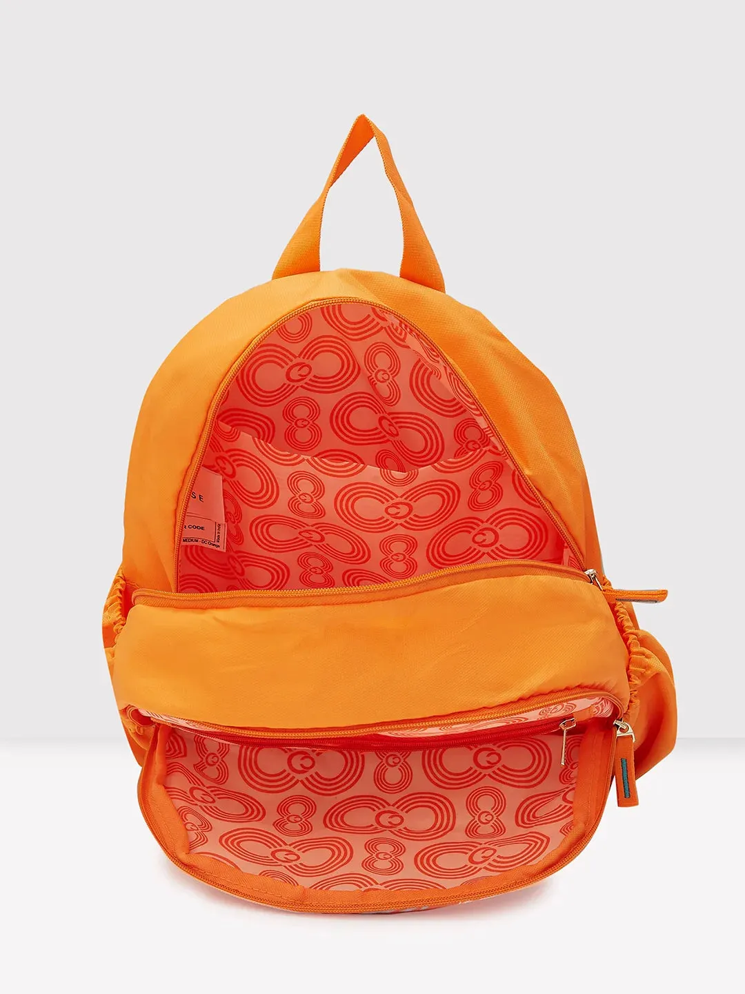 Caprese Xenia Medium Orange Printed Backpack