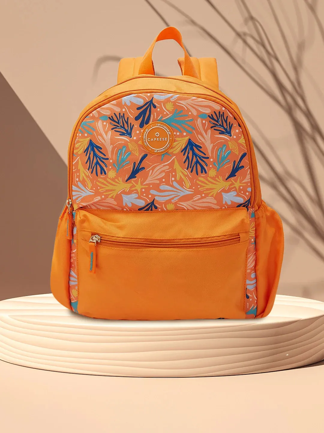 Caprese Xenia Medium Orange Printed Backpack