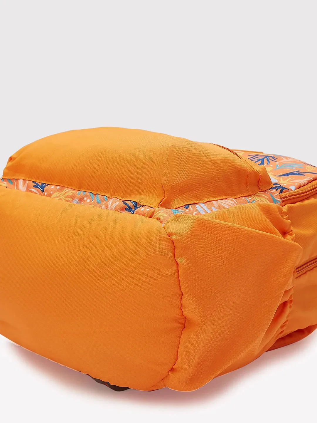Caprese Xenia Medium Orange Printed Backpack